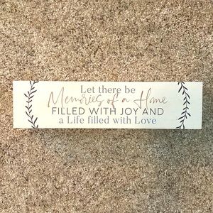 Cute white wooden block with happy home quote